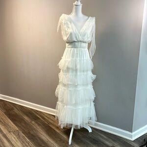 White dress beautiful pearl detail. Perfect for a bridal shower or wedding.